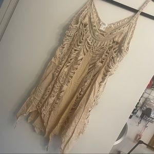 Boho long tank top with uneven hem. Perfect for over a swimsuit.